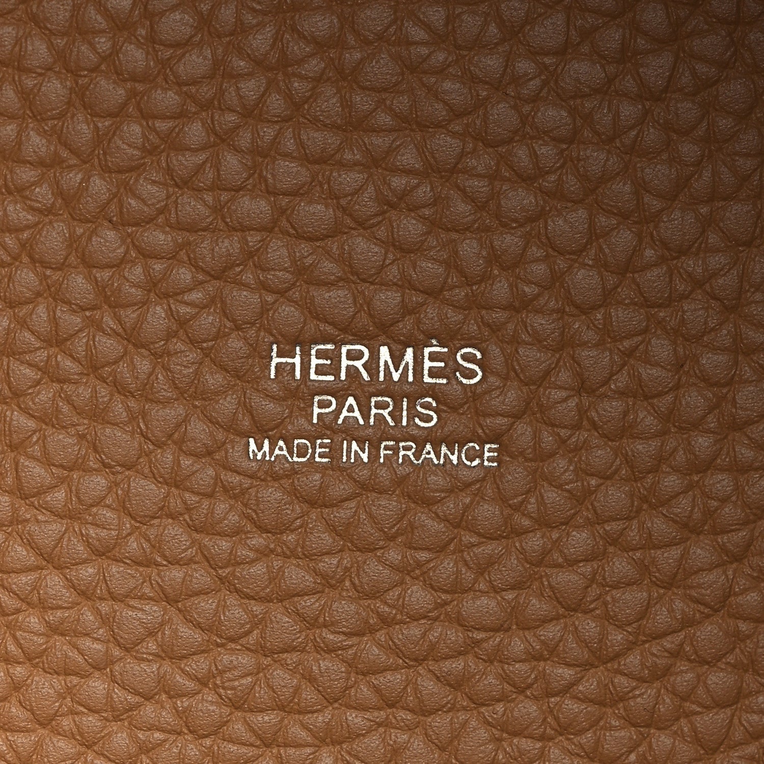 Tan leather with HERMÈS PARIS and MADE IN FRANCE embossed text.