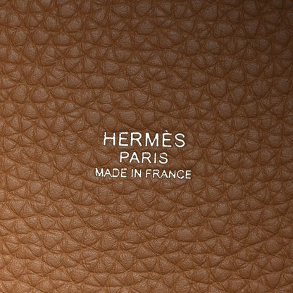 Tan leather with HERMÈS PARIS and MADE IN FRANCE embossed text.