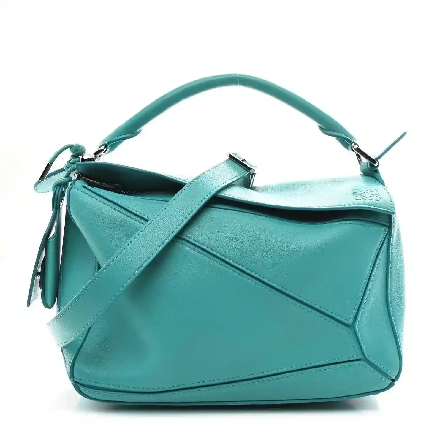 Small Puzzle bag in teal-blue nappa lambskin with top handle and tassel detail.