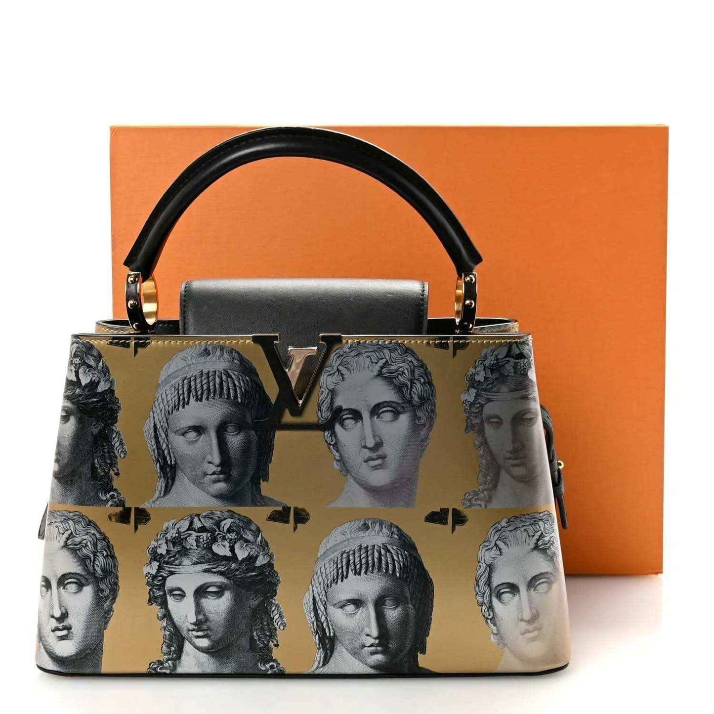 Handbag with gold face-print pattern, black handles, and gold-tone hardware