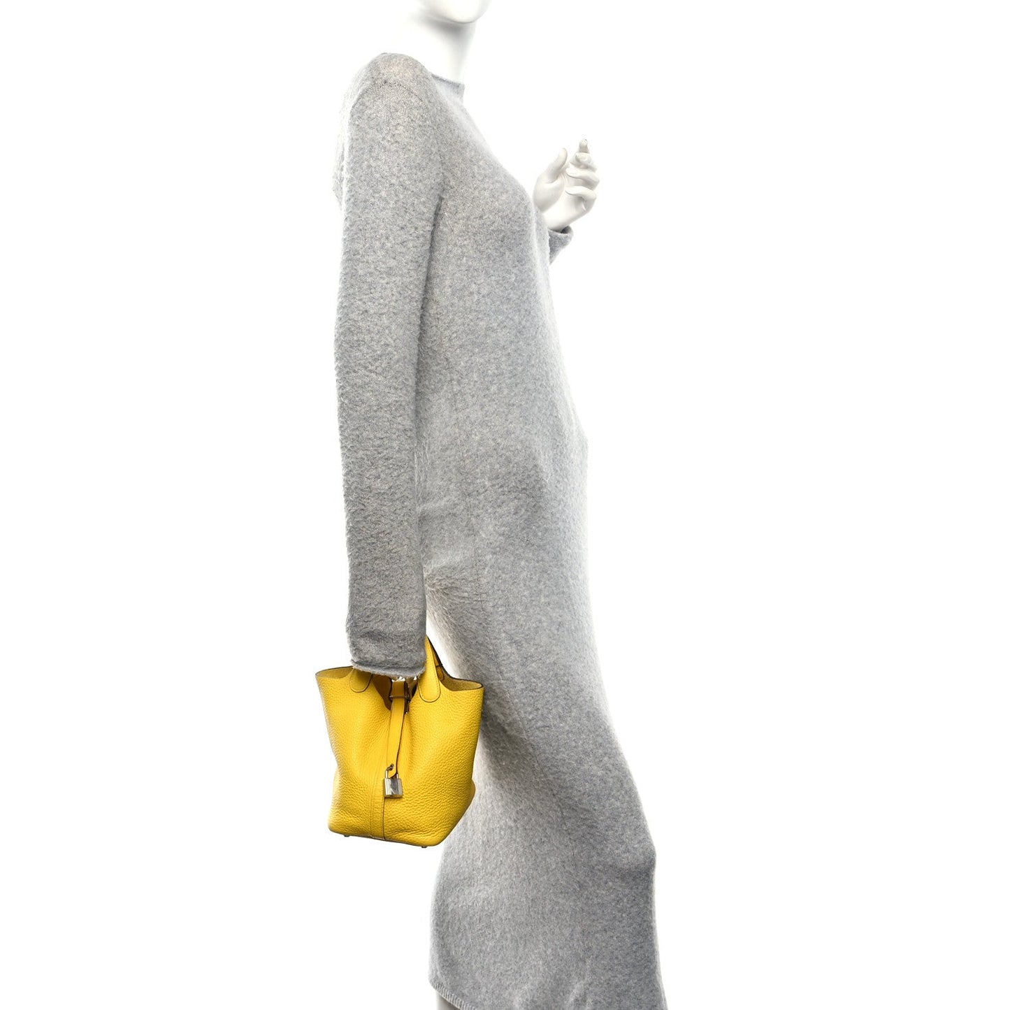 Lime yellow leather Picotin tote bag worn at side with small metal lock