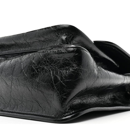 Black crinkled calfskin medium chain satchel with curved flap and top edge