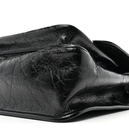 Black crinkled calfskin medium chain satchel with curved flap and top edge