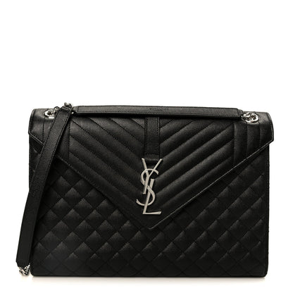 Black quilted triquilt satchel with YSL monogram and top handle, chain strap