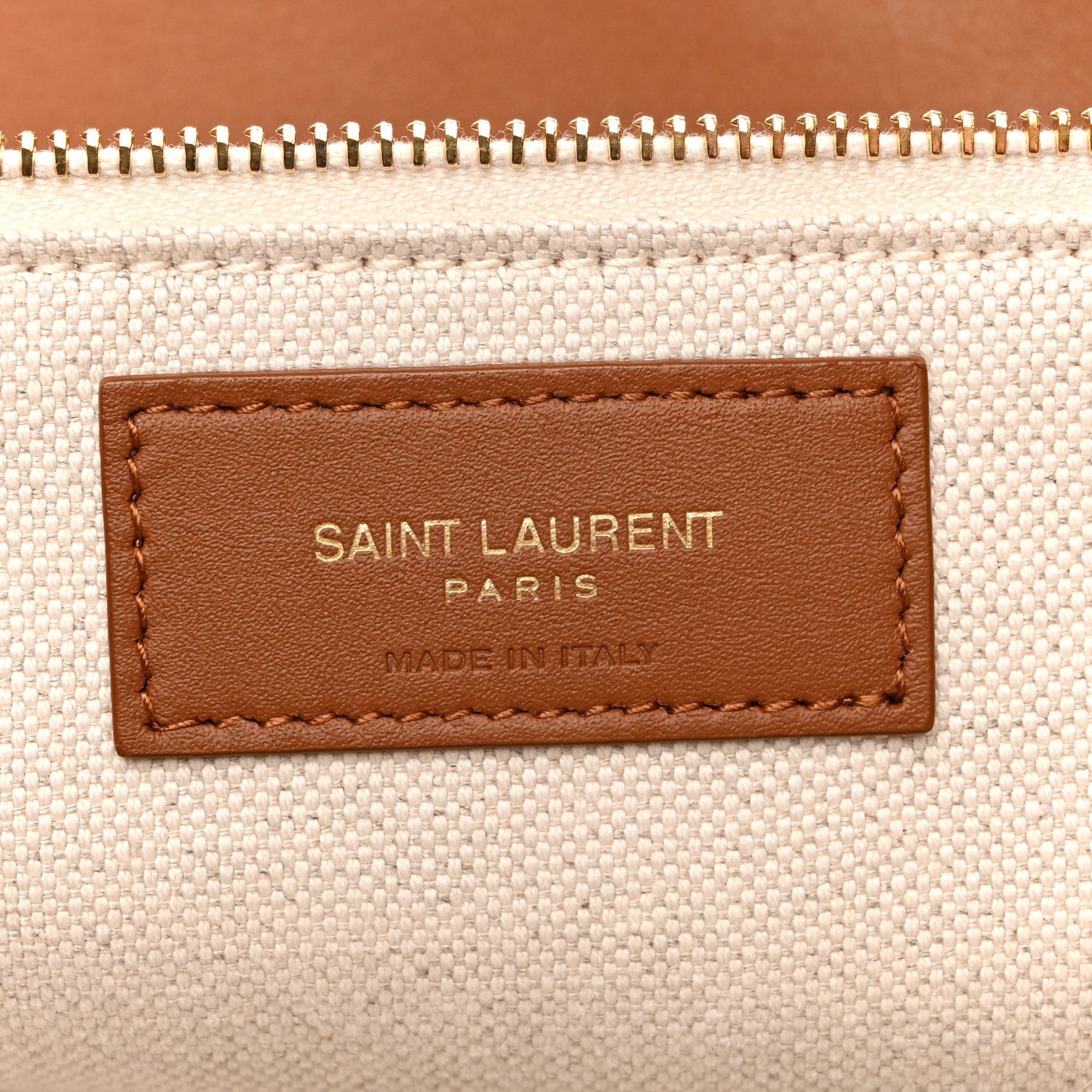 Canvas tote leather brand patch reading SAINT LAURENT PARIS, MADE IN ITALY