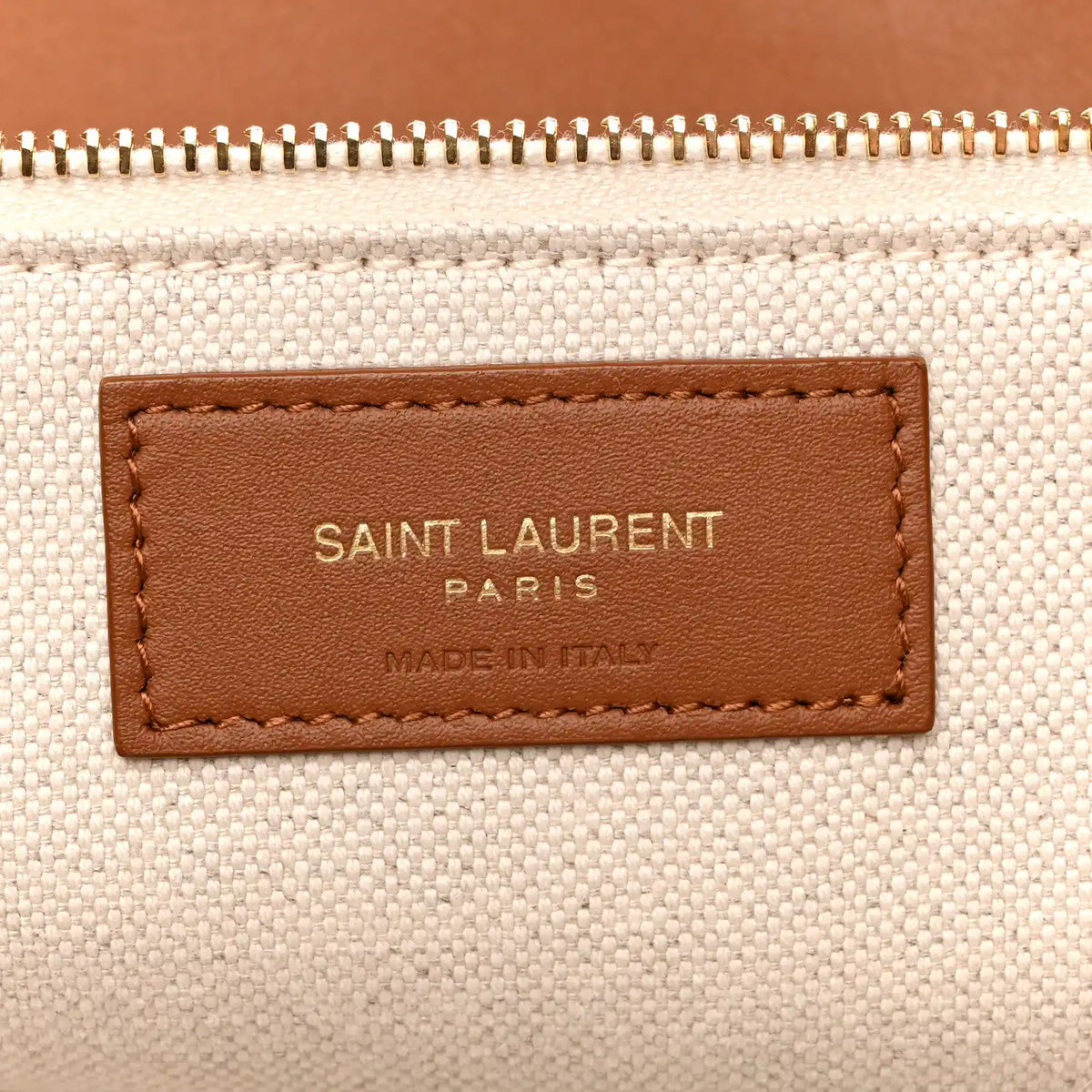 Canvas tote leather brand patch reading SAINT LAURENT PARIS, MADE IN ITALY