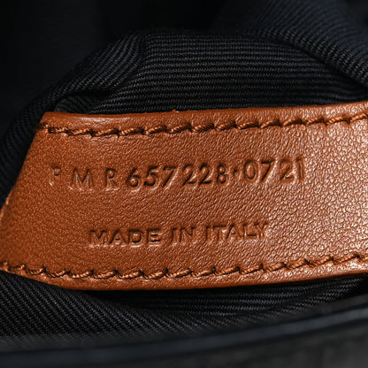 Leather interior stamp reading “MADE IN THE…” with serial code