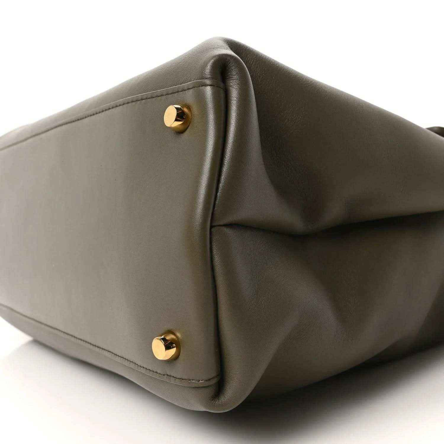 Cypress calfskin handbag side with two gold snap buttons and folded flap