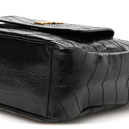 Black quilted leather tote closeup with textured crinkled finish