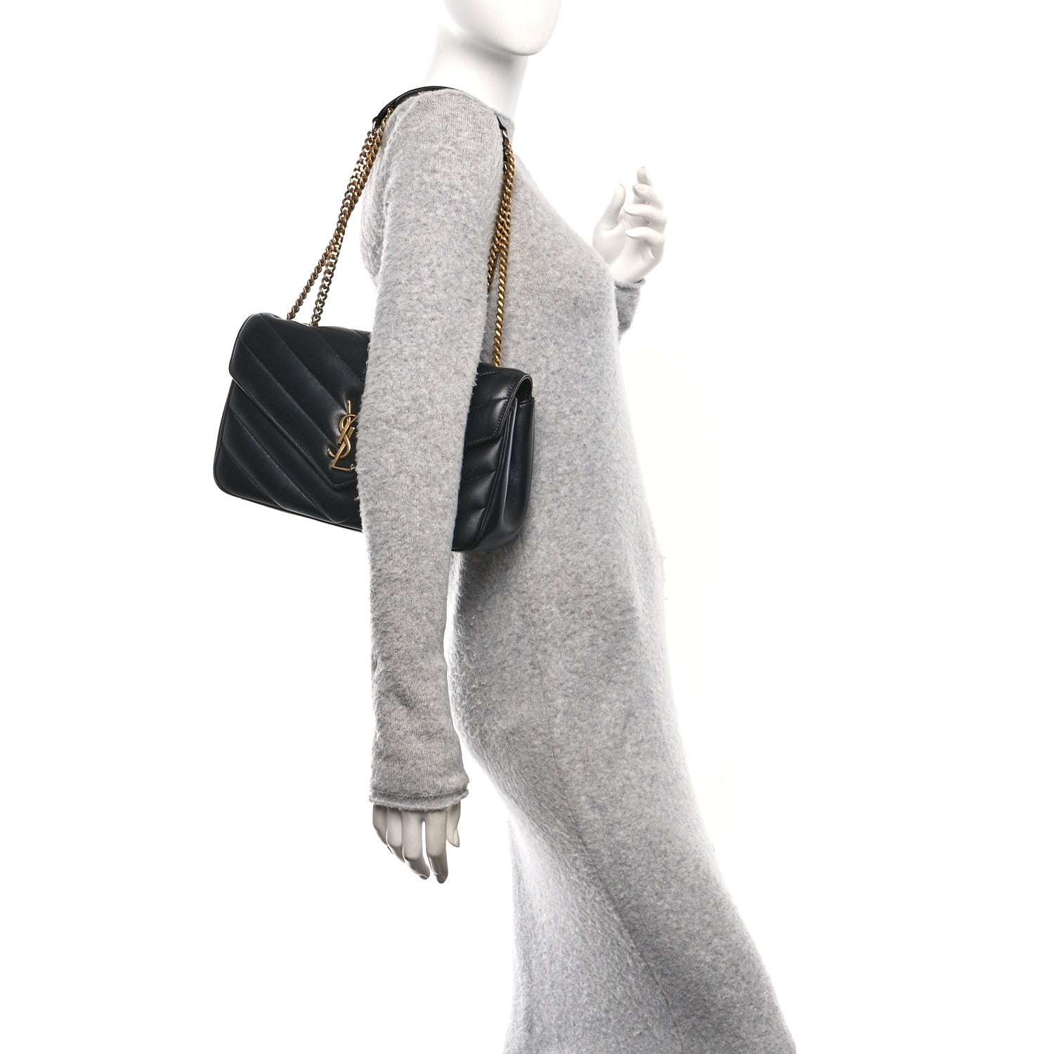 Black quilted shoulder bag with gold chain strap and structured side panel
