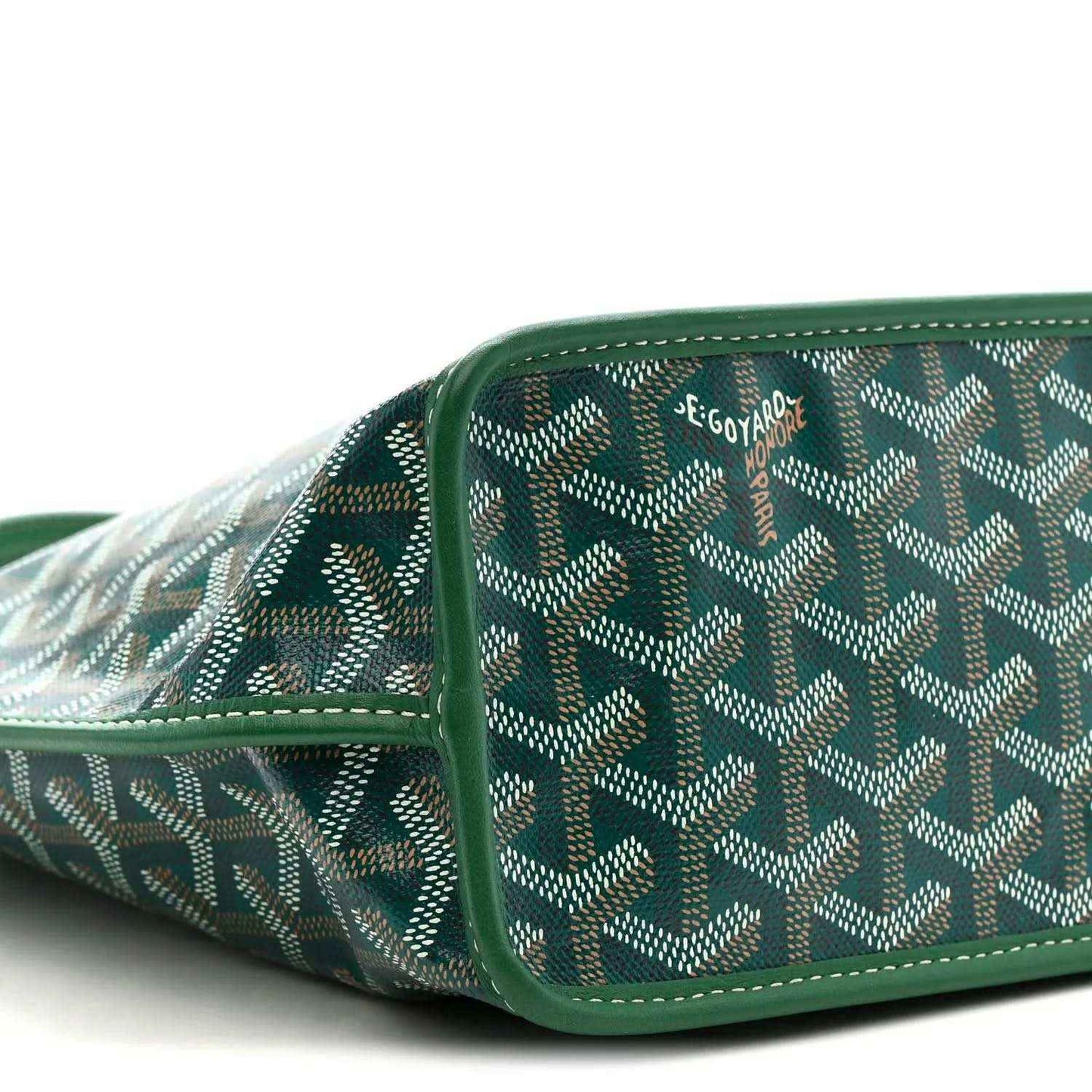 Patterned canvas section with green leather trim and reinforced side seam