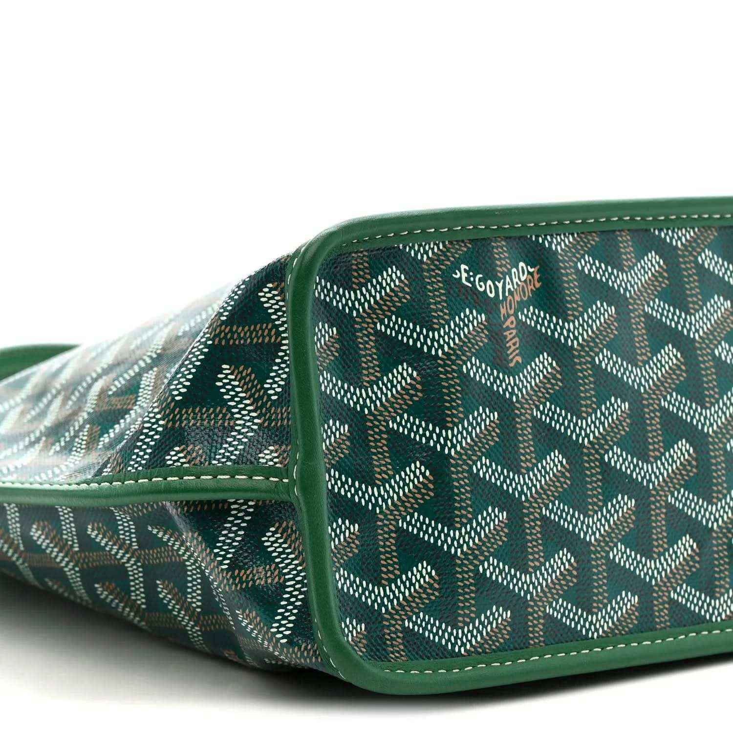 Patterned canvas section with green leather trim and reinforced side seam