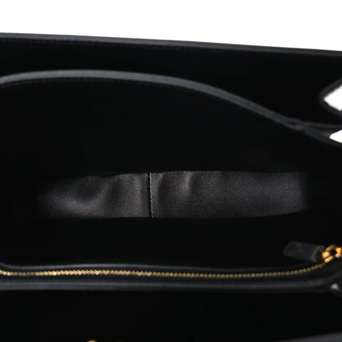 Shiny calfskin medium shoulder bag interior view with black lining and top zipper