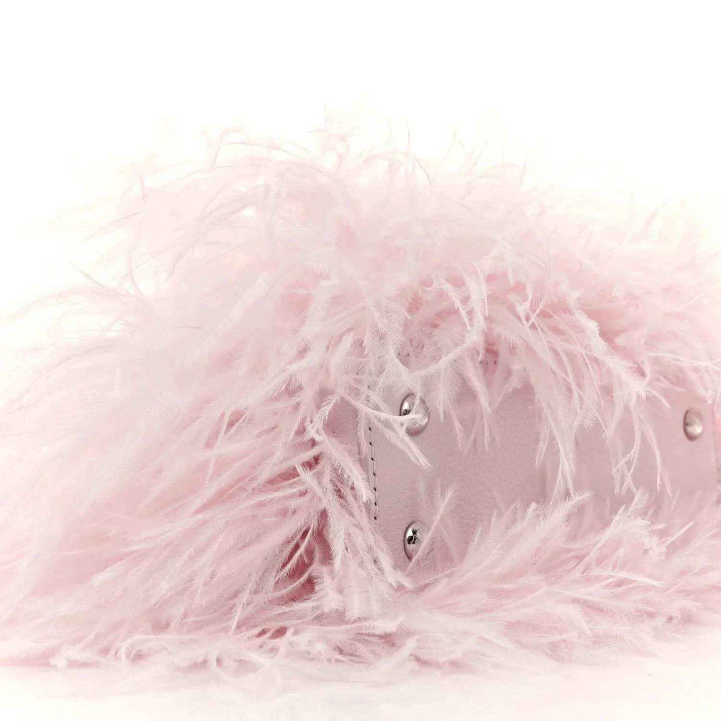 Pink ostrich-feather top handle mini bag with front snap closure