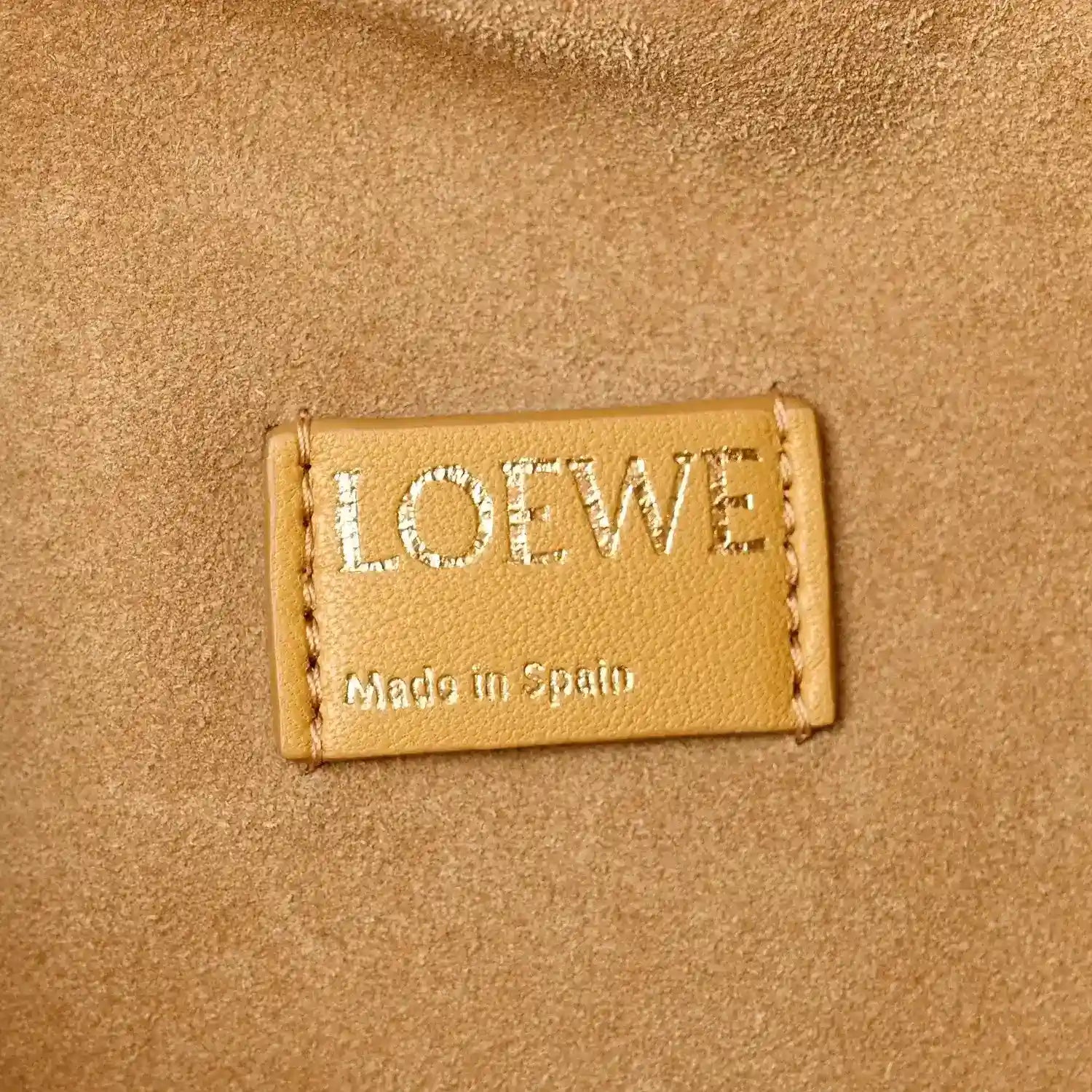 Loewe label on Sahara nappa leather clutch, Made in Spain