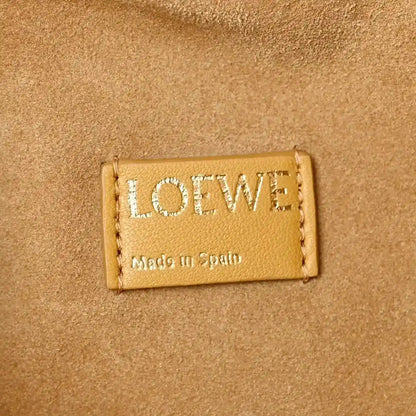 Loewe label on Sahara nappa leather clutch, Made in Spain