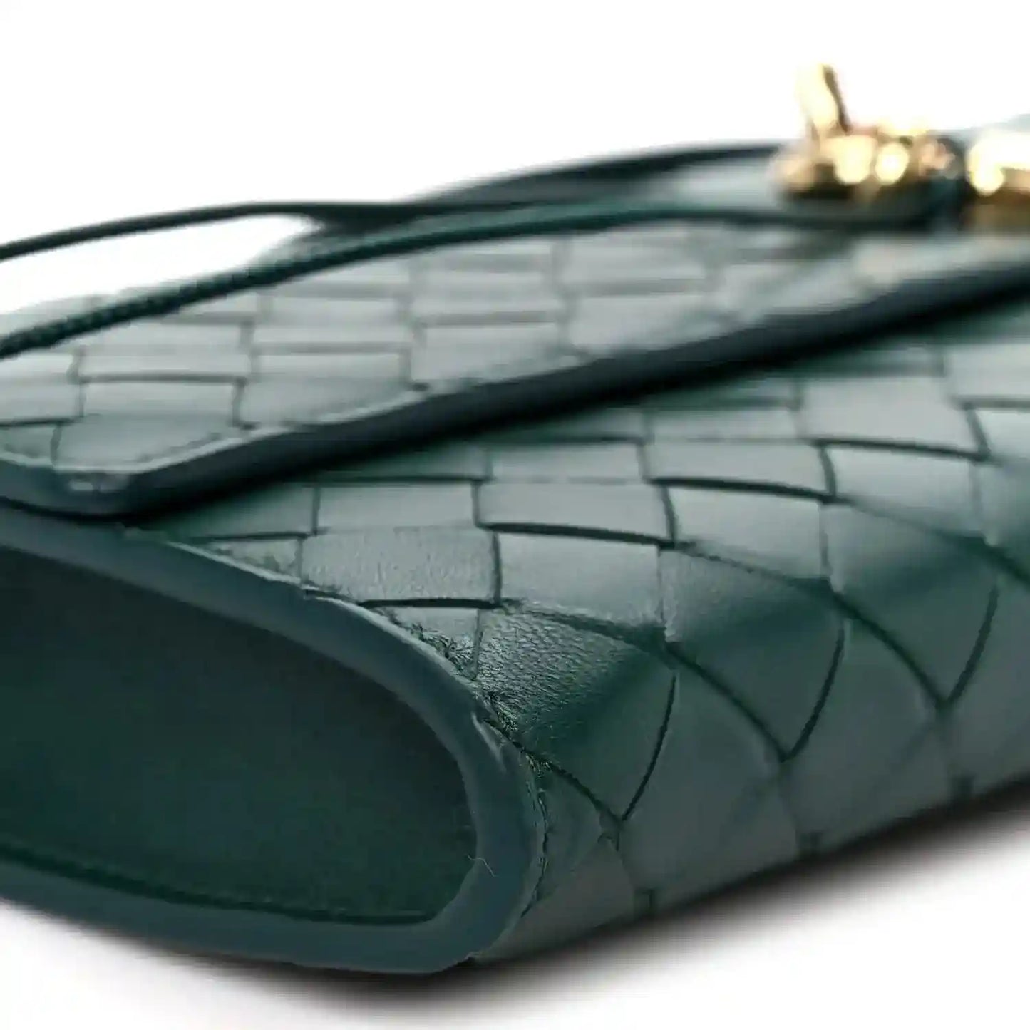 Emerald green intrecciato clutch bag interior pocket with leather weave detail