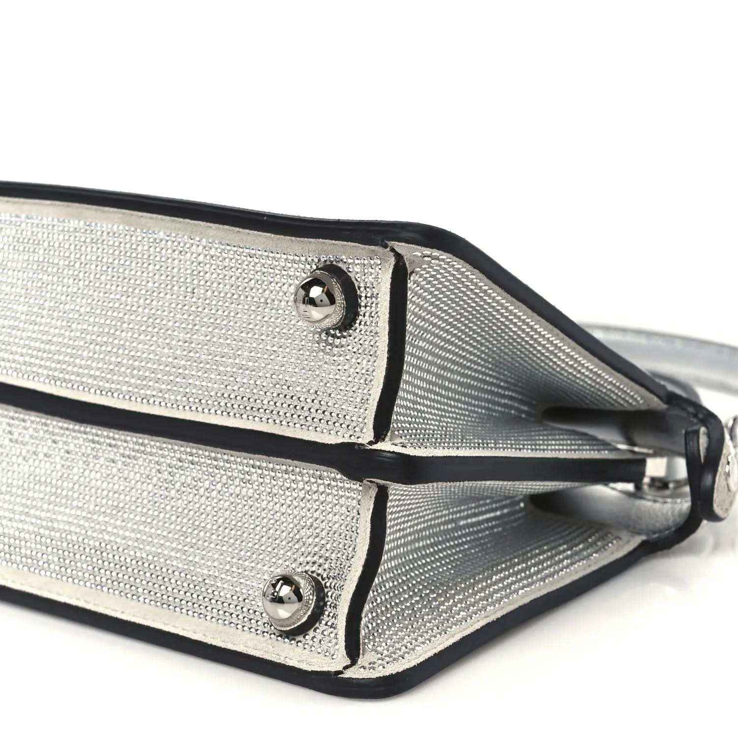 Fendi petite satchel closeup: silver mesh panels, black center seam, stud hardware