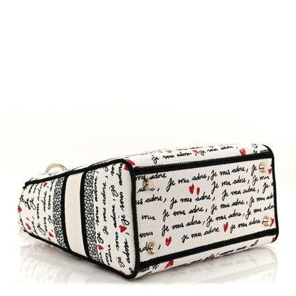 Medium Lady D-Lite bag with Dioramour canvas and black trim, top zipper closed