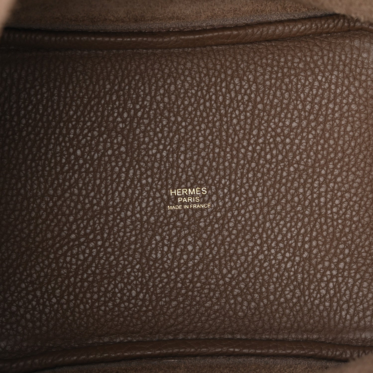 Taupe leather bag interior panel with Hermes Paris made in France stamp.