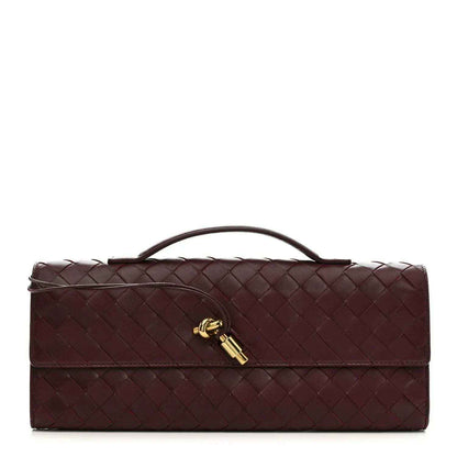 Bottega Veneta intrecciato nappa top-handle clutch in dark burgundy with gold clasp