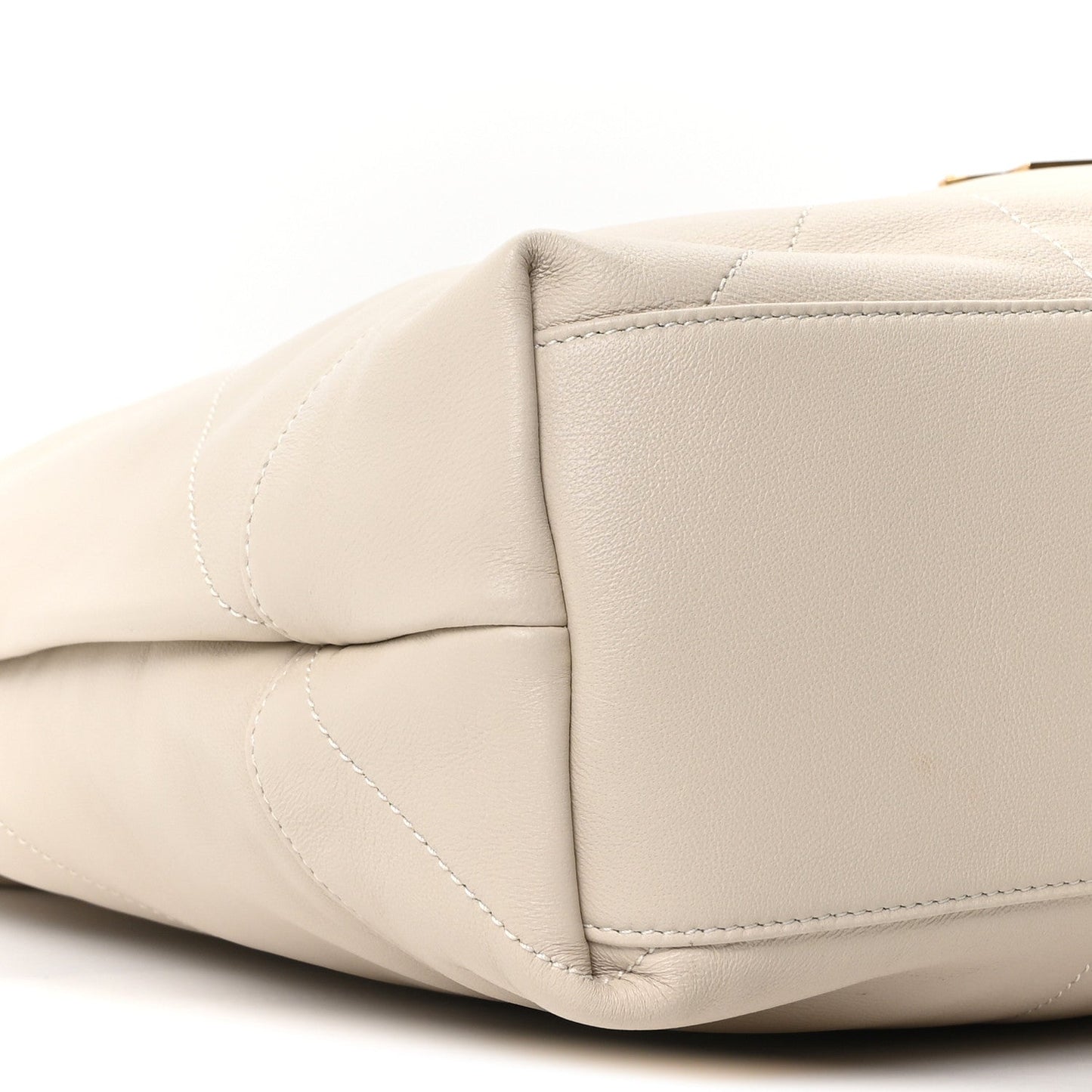 Off-white quilted lambskin shoulder bag with rounded side panel and stitching