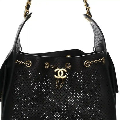 Chanel quilted small handbag in black perforated calfskin with CC logo drop