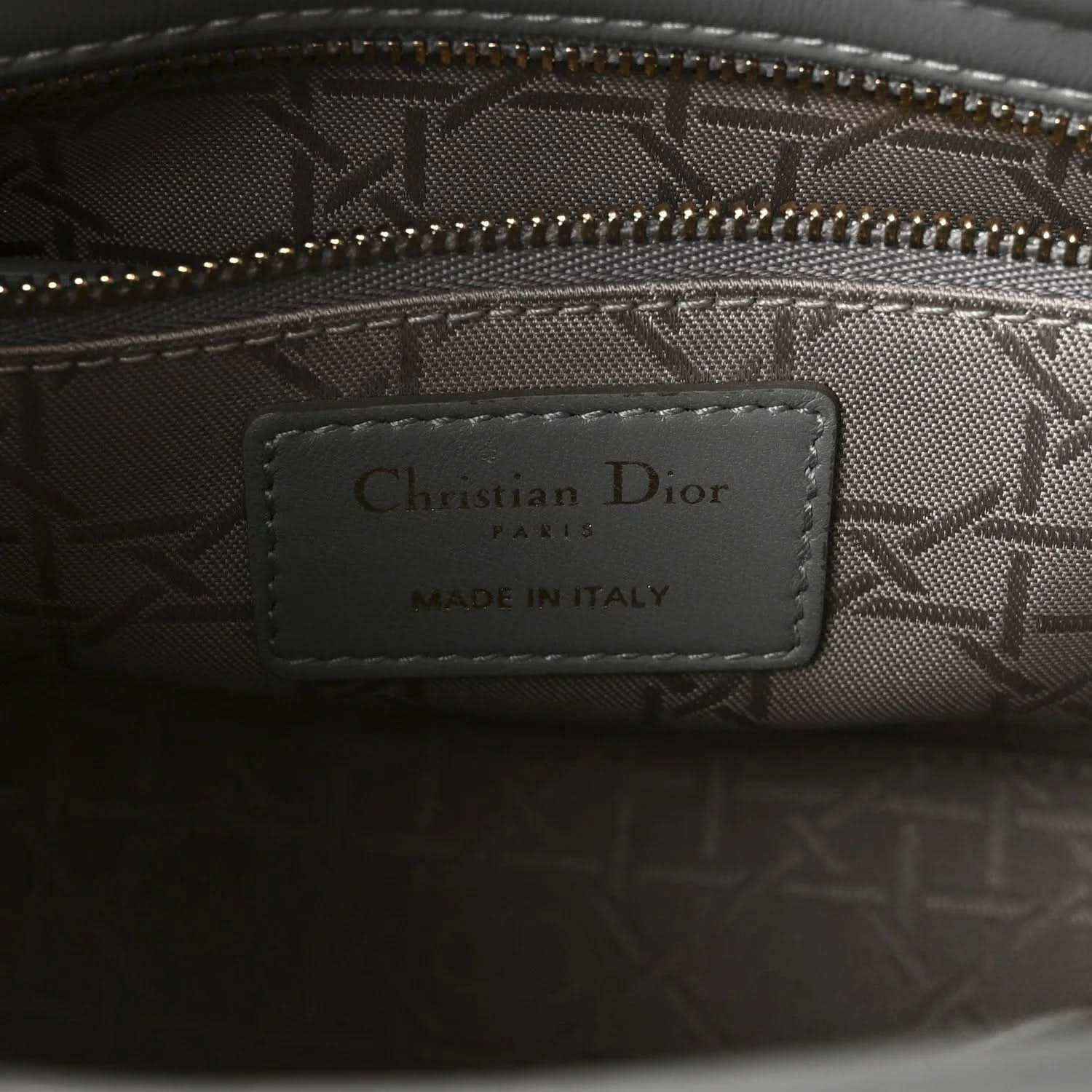 Grey jacquard interior with Christian Dior Paris label, made in Italy, and zipper