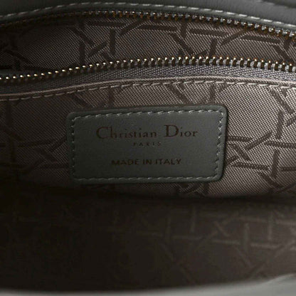 Grey jacquard interior with Christian Dior Paris label, made in Italy, and zipper