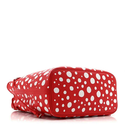 Red polka-dot shoulder bag with white dot pattern and rolled side profile