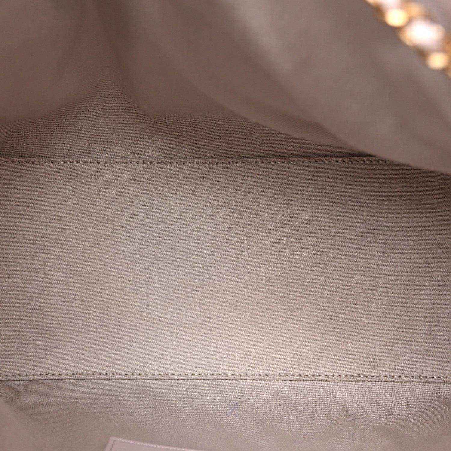 Lilac leather interior panel with visible edge seam stitching