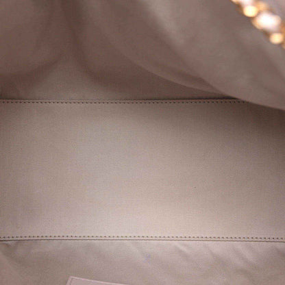 Lilac leather interior panel with visible edge seam stitching