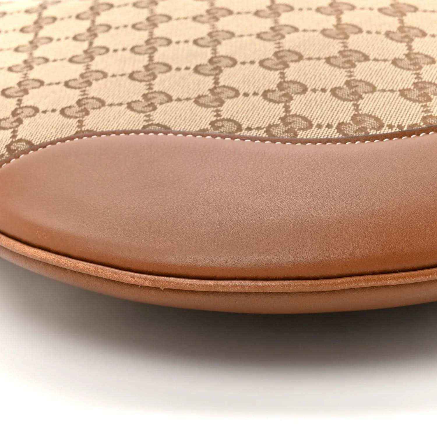 Brown leather bottom trim with GG monogram canvas on shoulder bag