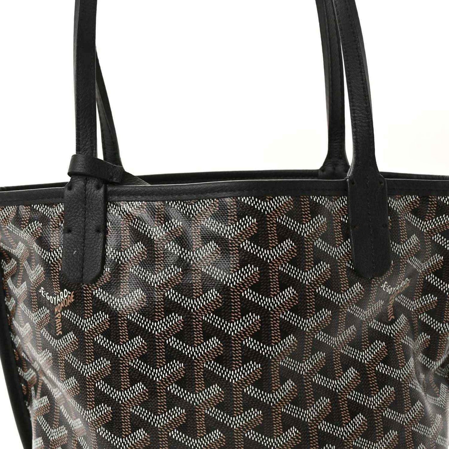 Reversible mini tote bag top view of black handles and patterned canvas with leather trim