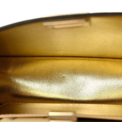 Gold satin-like interior lining with top flap edge and reflective metallic trim