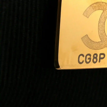 Yellow fabric panel with partial Chanel mark and CG8P text