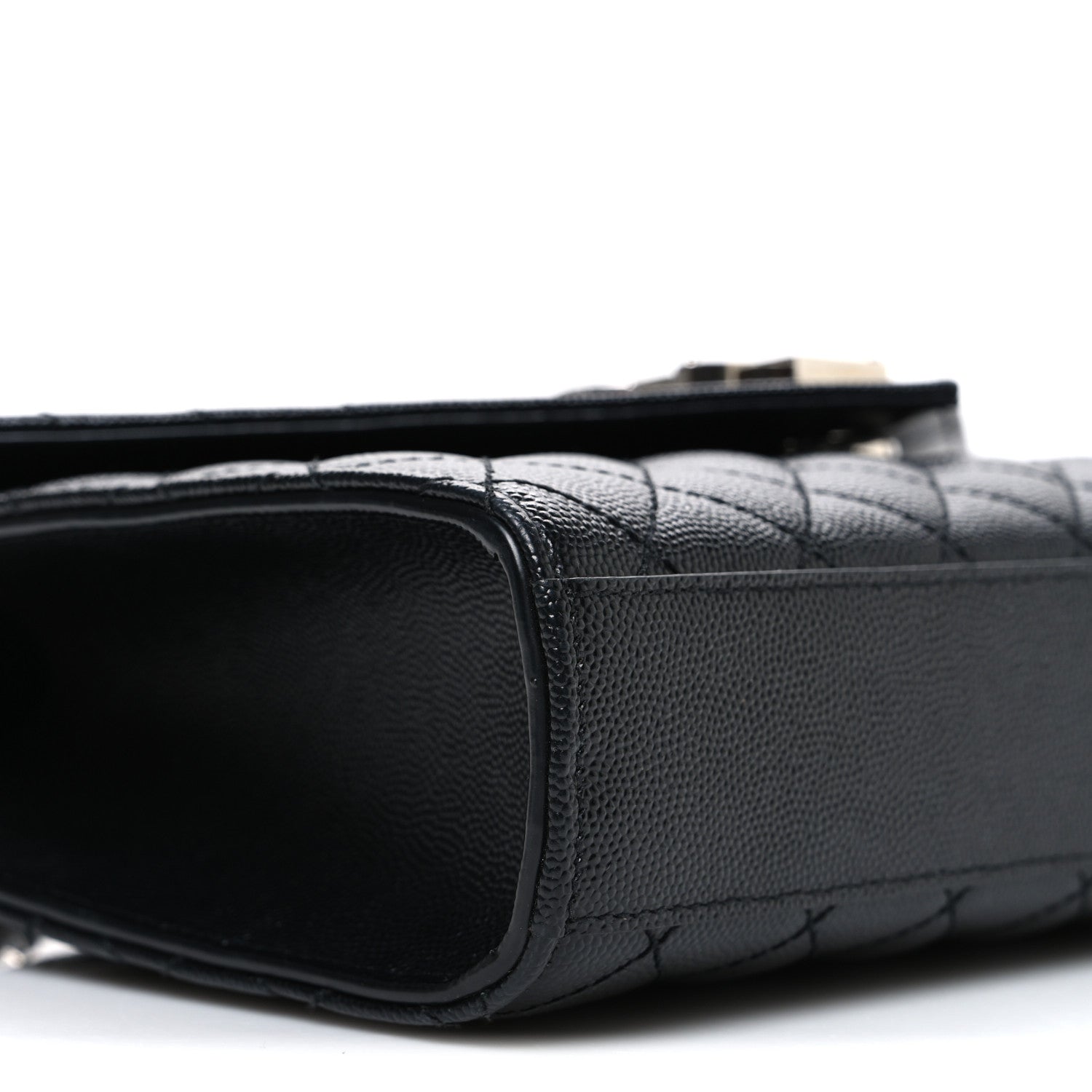 Black quilted leather satchel side with smooth trim and top handle strap