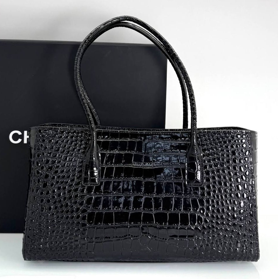 Black croc-embossed small shopping tote with double top handles and front logo plaque
