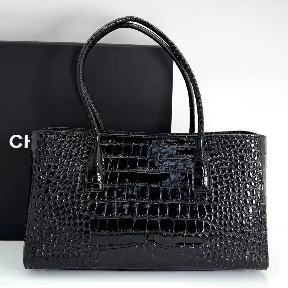 Black croc-embossed small shopping tote with double top handles and front logo plaque