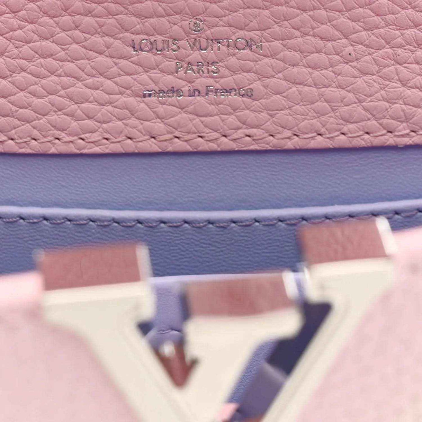 Louis Vuitton stamp on pink and blue pebbled leather interior