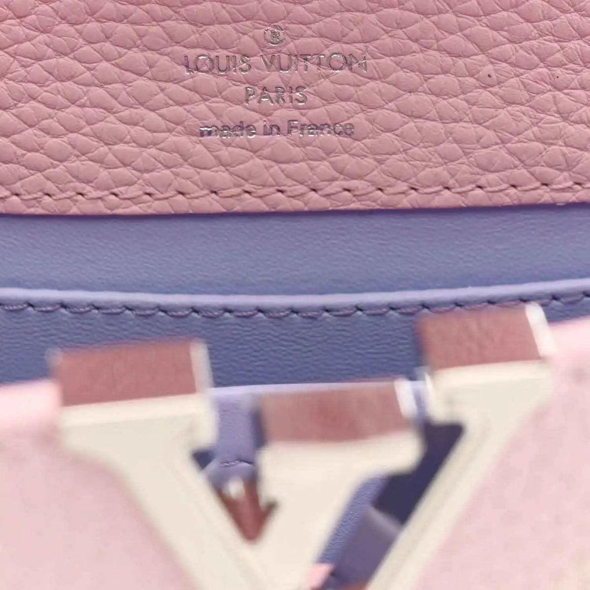 Louis Vuitton stamp on pink and blue pebbled leather interior