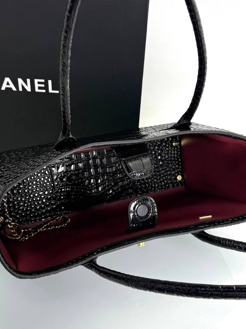 Open small shopping tote in black croc-embossed leather with burgundy interior and handle
