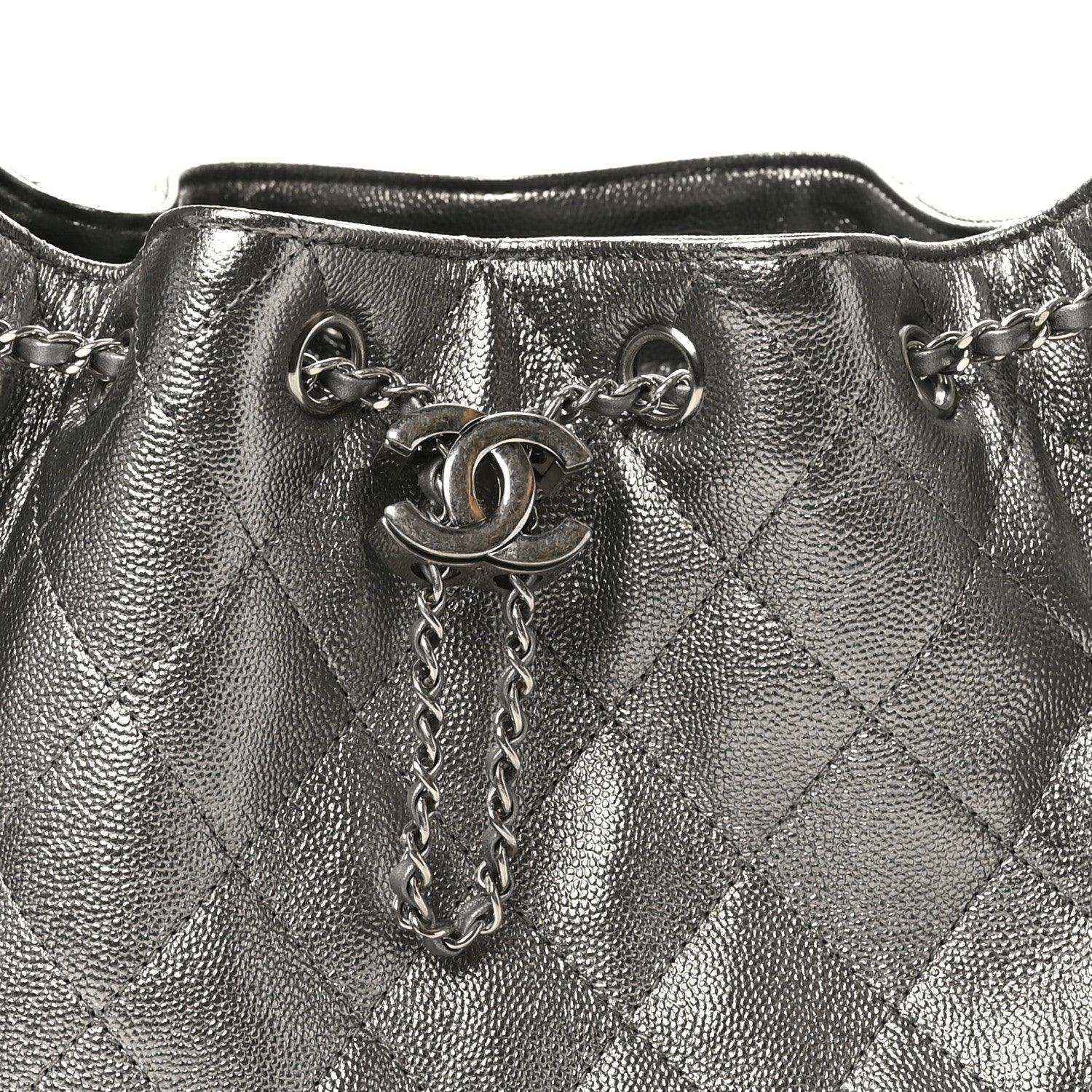 Chanel metallic quilted handbag top view with chain strap and logo clasp