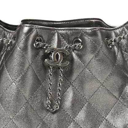 Chanel metallic quilted handbag top view with chain strap and logo clasp