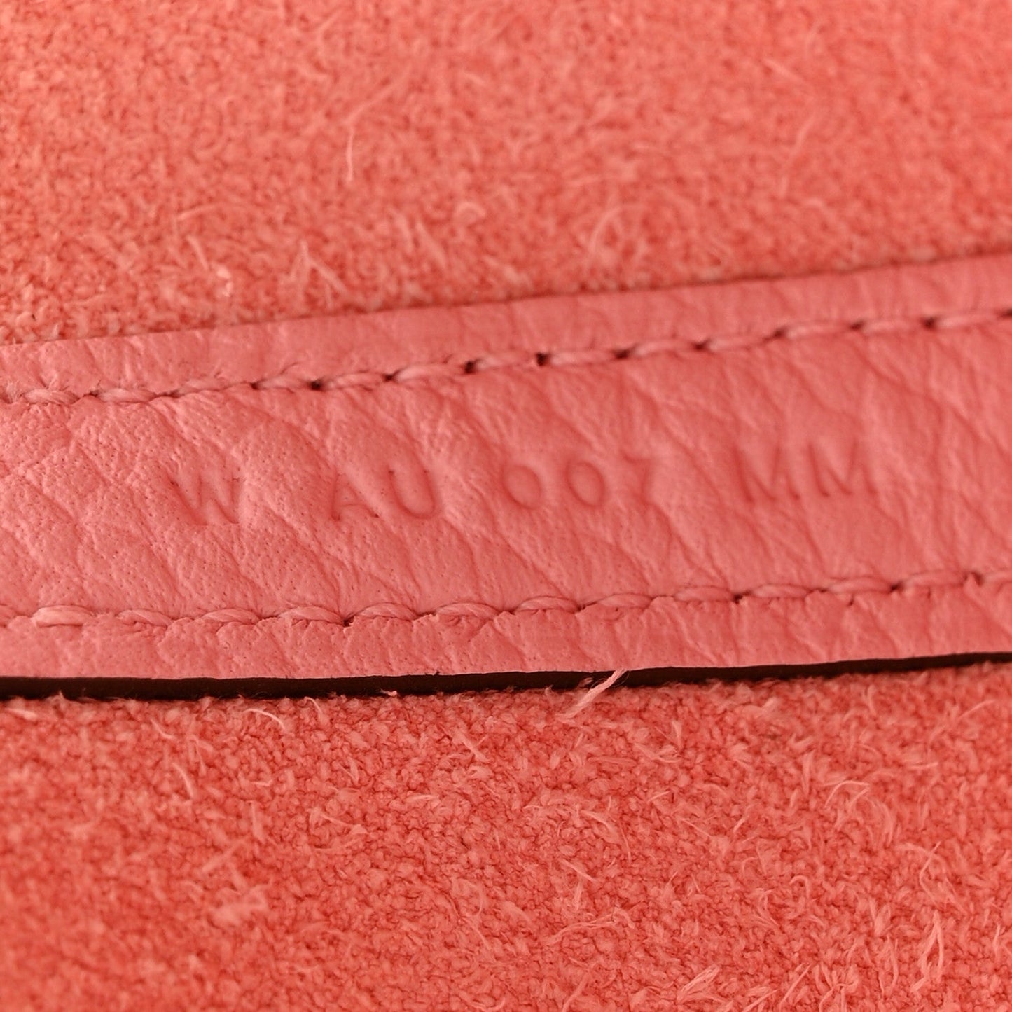 Rose pink leather edge seam with contrast stitching detail