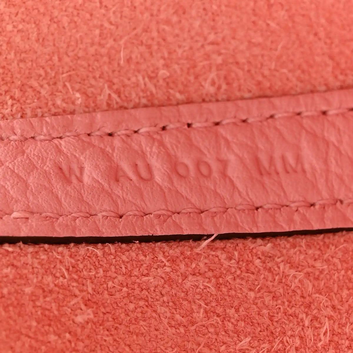 Rose pink leather edge seam with contrast stitching detail