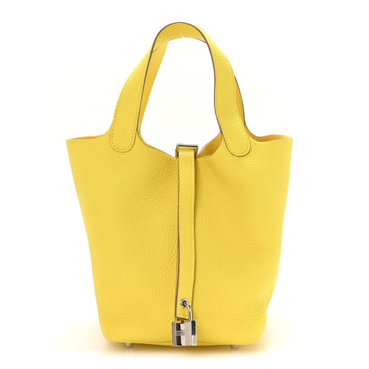 Lime leather tote with top handles and front vertical turn-lock clasp
