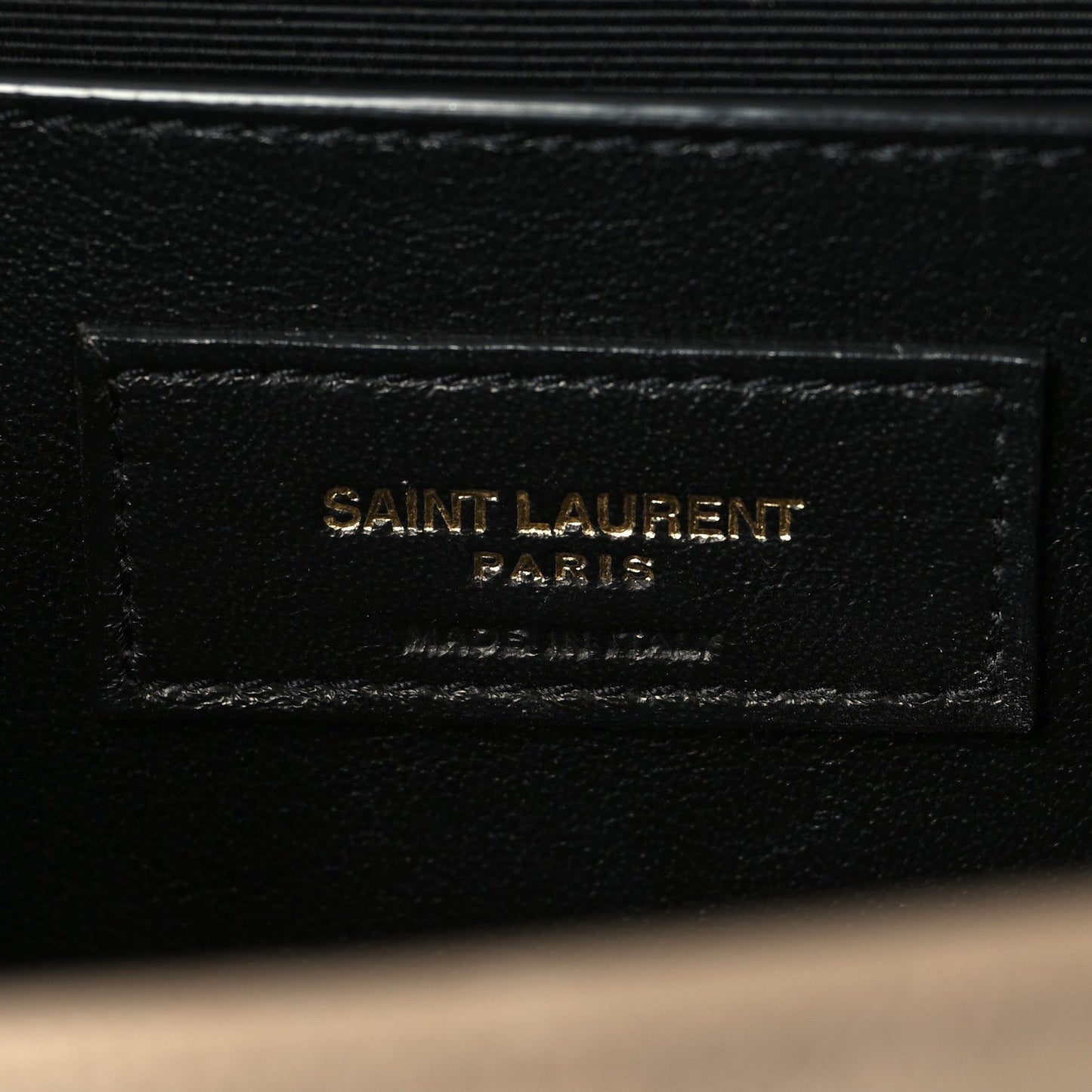 Black leather interior label reading SAINT LAURENT PARIS