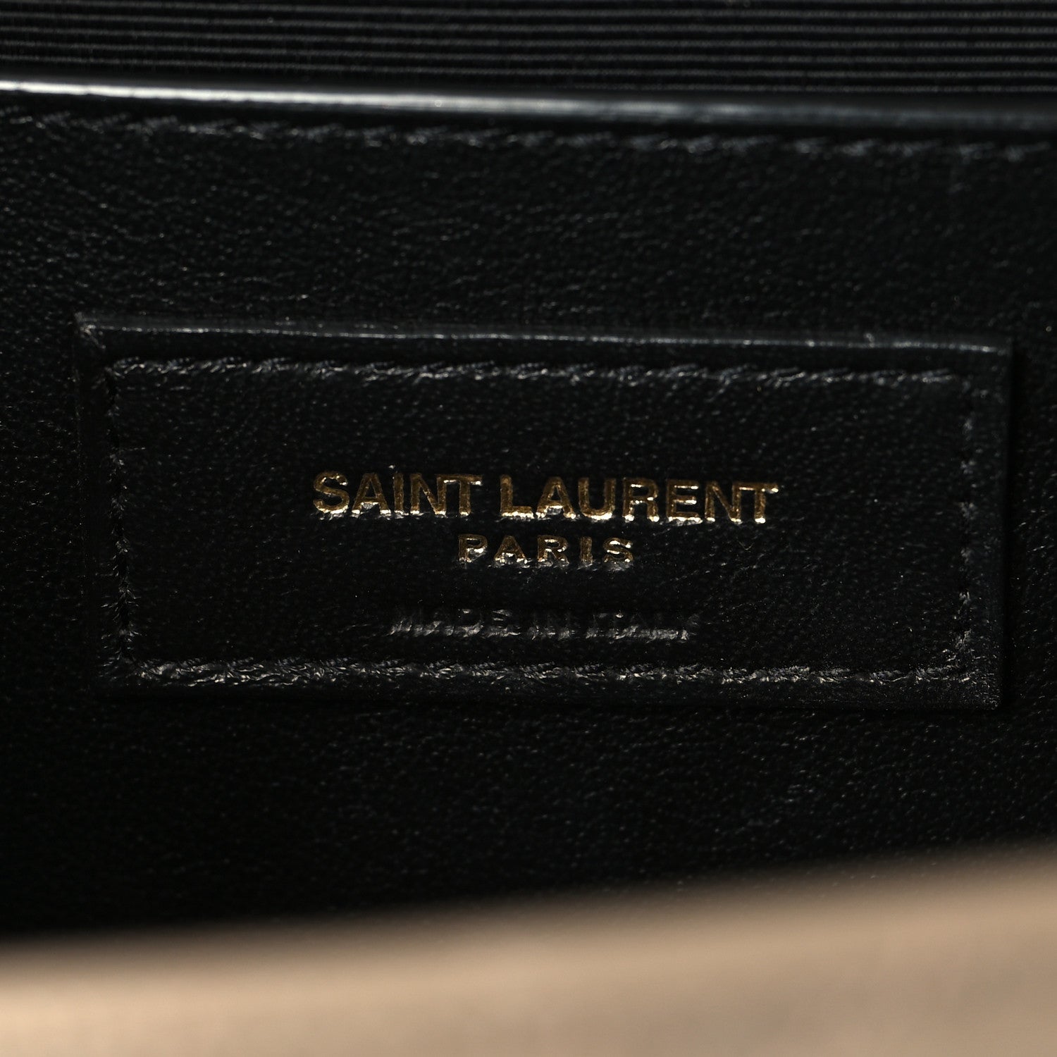 Black leather interior label reading SAINT LAURENT PARIS
