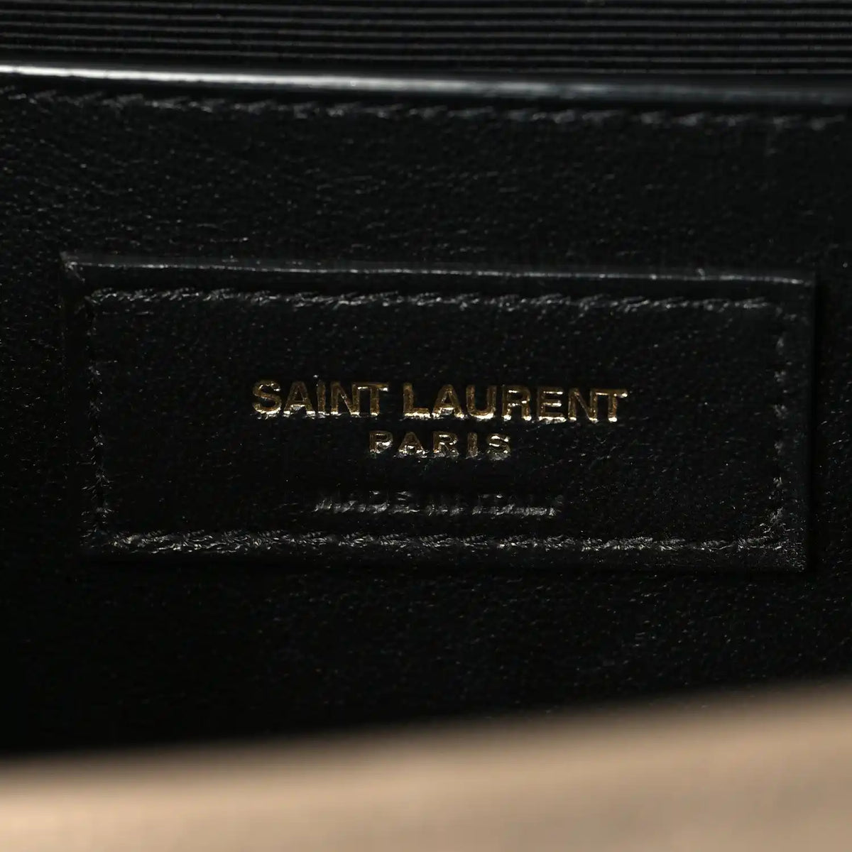Black leather interior label reading SAINT LAURENT PARIS